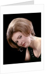 1960s portrait serious woman black sequin evening diamond earrings dress bouffant hairstyle looking at camera by Anonymous