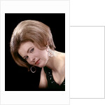 1960s portrait serious woman black sequin evening diamond earrings dress bouffant hairstyle looking at camera by Anonymous