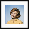 1960s smiling blond woman wearing a yellow sweater head tilted quizzical expression by Anonymous