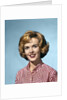 1960s portrait smiling blond woman wearing a red white checked blouse by Anonymous
