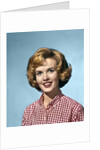 1960s portrait smiling blond woman wearing a red white checked blouse by Anonymous