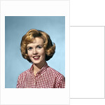 1960s portrait smiling blond woman wearing a red white checked blouse by Anonymous