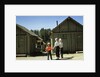 1950s mother and children visiting yellowstone national park wyoming 1956, looking at bear behind cabins by Anonymous
