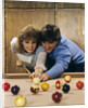 1980s teen couple playing pool by Anonymous