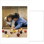 1980s teen couple playing pool by Anonymous
