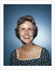 1960s smiling brunette woman in print dress looking up by Anonymous