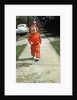 1950s little boy in red outfit running on pavement with mother just behind by Anonymous