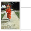 1950s little boy in red outfit running on pavement with mother just behind by Anonymous