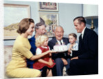 1960s three generation family with birthday cake by Anonymous