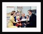 1960s three generation family with birthday cake by Anonymous