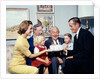 1960s three generation family with birthday cake by Anonymous