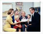 1960s three generation family with birthday cake by Anonymous