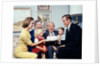 1960s three generation family with birthday cake by Anonymous