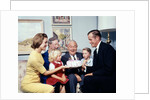 1960s three generation family with birthday cake by Anonymous
