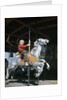 1950s excited boy riding carved wooden carousel merry-go-round horse by Anonymous