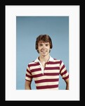 1970s portrait of smiling teenage boy wearing striped rugby shirt looking at camera by Anonymous