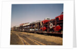 1960 1960s new cars & trucks transported on northern pacific railroad railway train transportation by Anonymous
