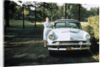 1950s 1955 woman standing beside 1954 mercury automobile by Anonymous