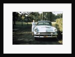 1950s 1955 woman standing beside 1954 mercury automobile by Anonymous