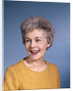 1960s portrait smiling elderly woman wearing orange top laughing looking to side by Anonymous