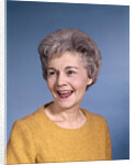 1960s portrait smiling elderly woman wearing orange top laughing looking to side by Anonymous
