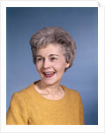 1960s portrait smiling elderly woman wearing orange top laughing looking to side by Anonymous