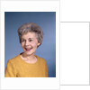1960s portrait smiling elderly woman wearing orange top laughing looking to side by Anonymous
