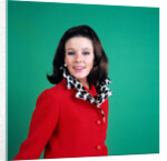 1960s smiling young woman brunette red coat leopard skin fur collar by Anonymous