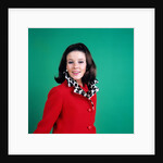 1960s smiling young woman brunette red coat leopard skin fur collar by Anonymous