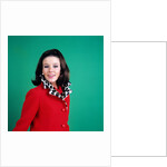 1960s smiling young woman brunette red coat leopard skin fur collar by Anonymous