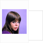 1960s portrait young brunette woman teen head shoulders purple background by Anonymous