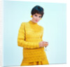 1960s brunette woman short pixie hair style yellow knit sweater earrings holding wine glass by Anonymous