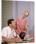 1960s couple husband wife bowling checking the score indoor by Anonymous