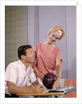 1960s couple husband wife bowling checking the score indoor by Anonymous