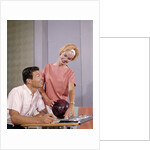 1960s couple husband wife bowling checking the score indoor by Anonymous