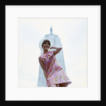 1960s young woman print miniskirt dress summer hat in front empire state building new york city by Anonymous