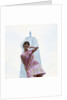 1960s young woman print miniskirt dress summer hat in front empire state building new york city by Anonymous