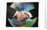 1960s male handshake in front of world globe by Anonymous