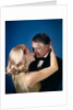 Romantic couple embracing about to kiss husband wife evening dress studio 1970s 1960s by Anonymous