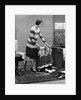 1920s woman packing clothes for travel by Anonymous
