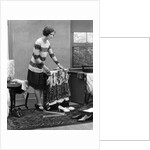 1920s woman packing clothes for travel by Anonymous