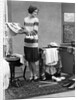 1920s woman packing clothes for travel by Anonymous