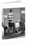 1920s woman packing clothes for travel by Anonymous