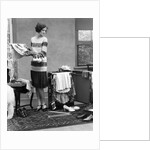 1920s woman packing clothes for travel by Anonymous