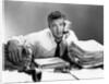1950s portrait man overworked with desk full of papers by Anonymous