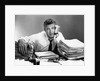 1950s portrait man overworked with desk full of papers by Anonymous