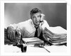 1950s portrait man overworked with desk full of papers by Anonymous
