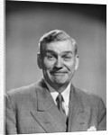 1950s mature middle aged man smiling business suit tie happy amused funny face expression by Anonymous