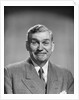 1950s mature middle aged man smiling business suit tie happy amused funny face expression by Anonymous
