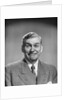 1950s mature middle aged man smiling business suit tie happy amused funny face expression by Anonymous